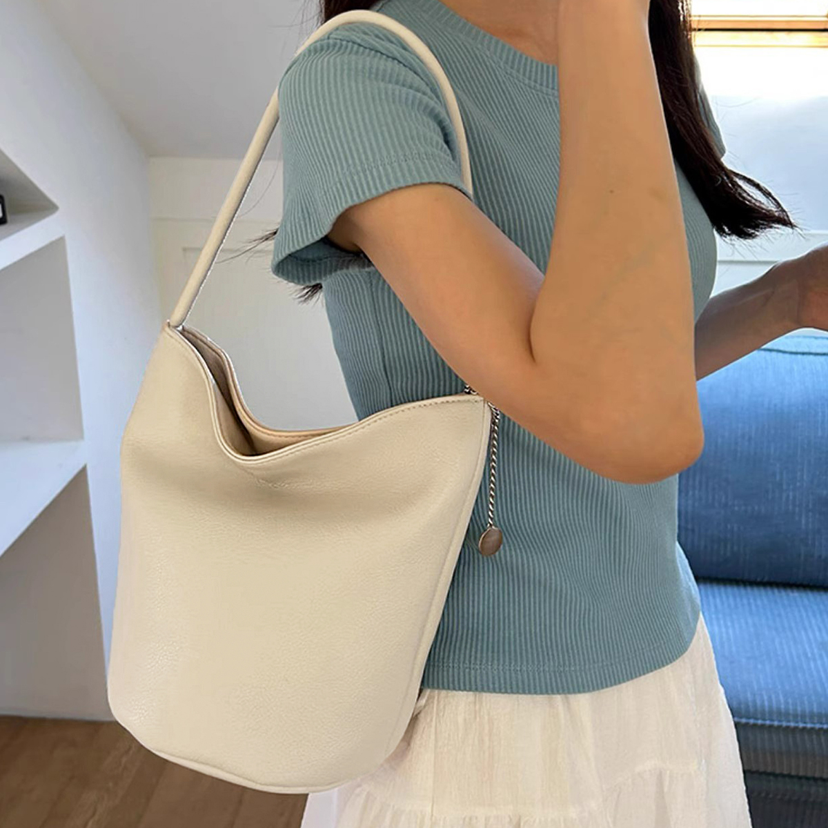 PrettyPettyMerch Women's Open-Top Faux Leather Bucket Bag in Cream (photo 2)