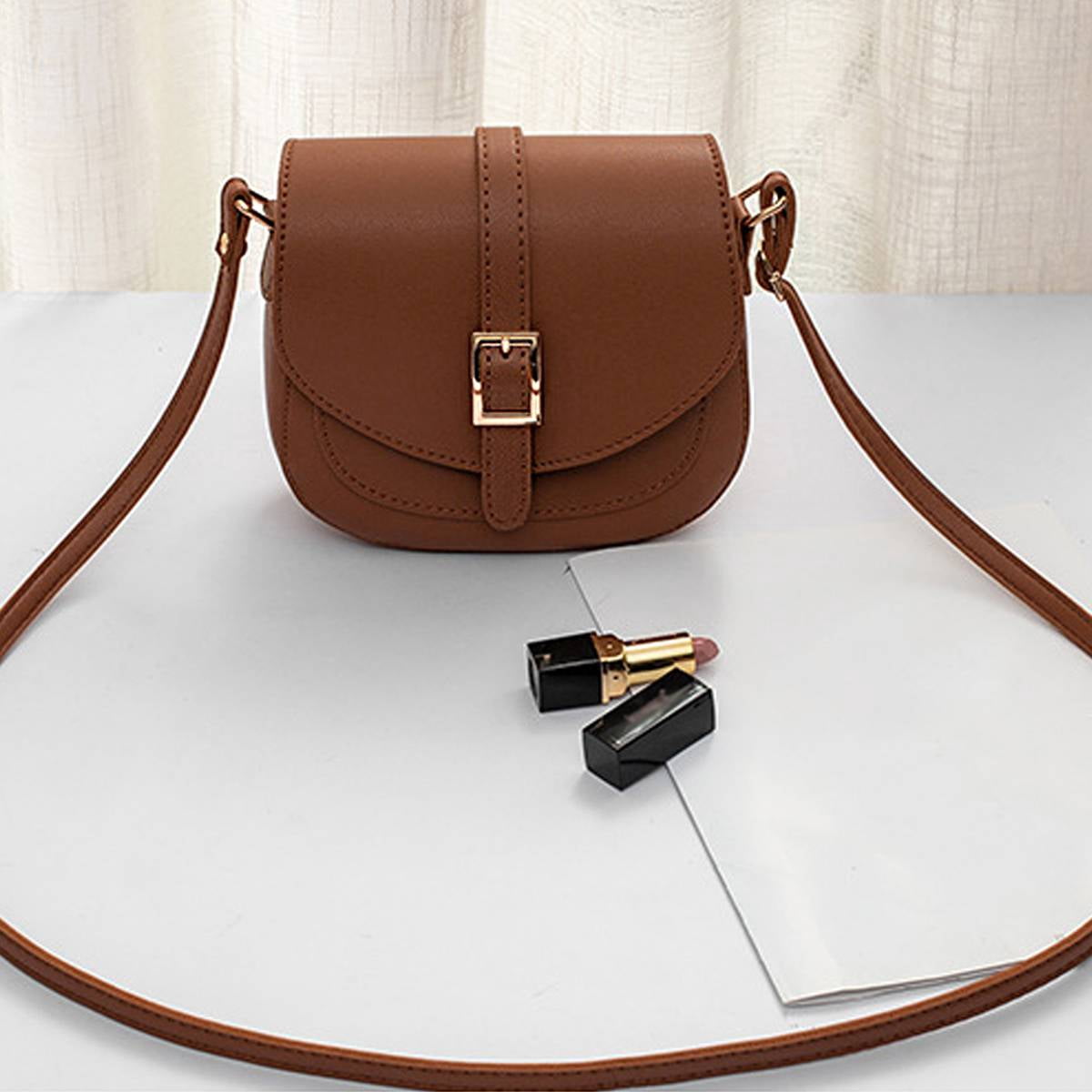 PrettyPettyMerch Women's Faux Leather Flap Crossbody Bag with Buckle Strap in Brown (photo 2)